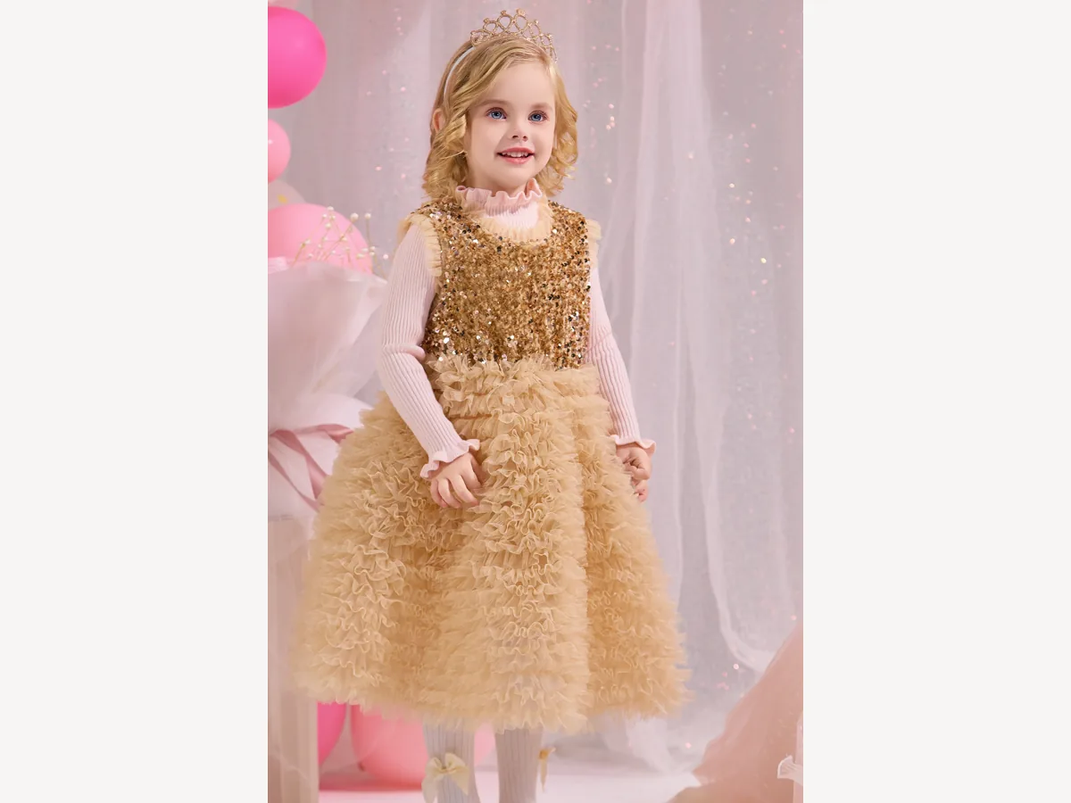 Girl wearing a gold layered festive dress